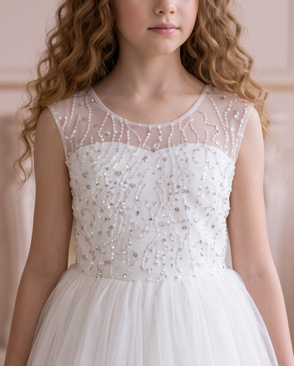 Side view of the Celestial Grace white dress showing the full tulle skirt in motion beside a window.