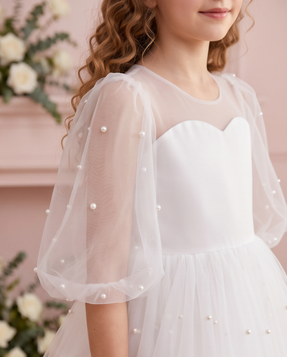 Close-up of pearl-style beads on a sheer puff sleeve and the sweetheart-shaped bodice of the Pearl Reverie dress.