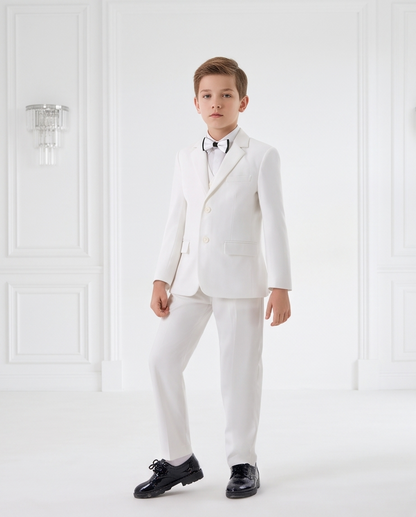 Front view of boy wearing white formal suit with waistcoat and bow tie