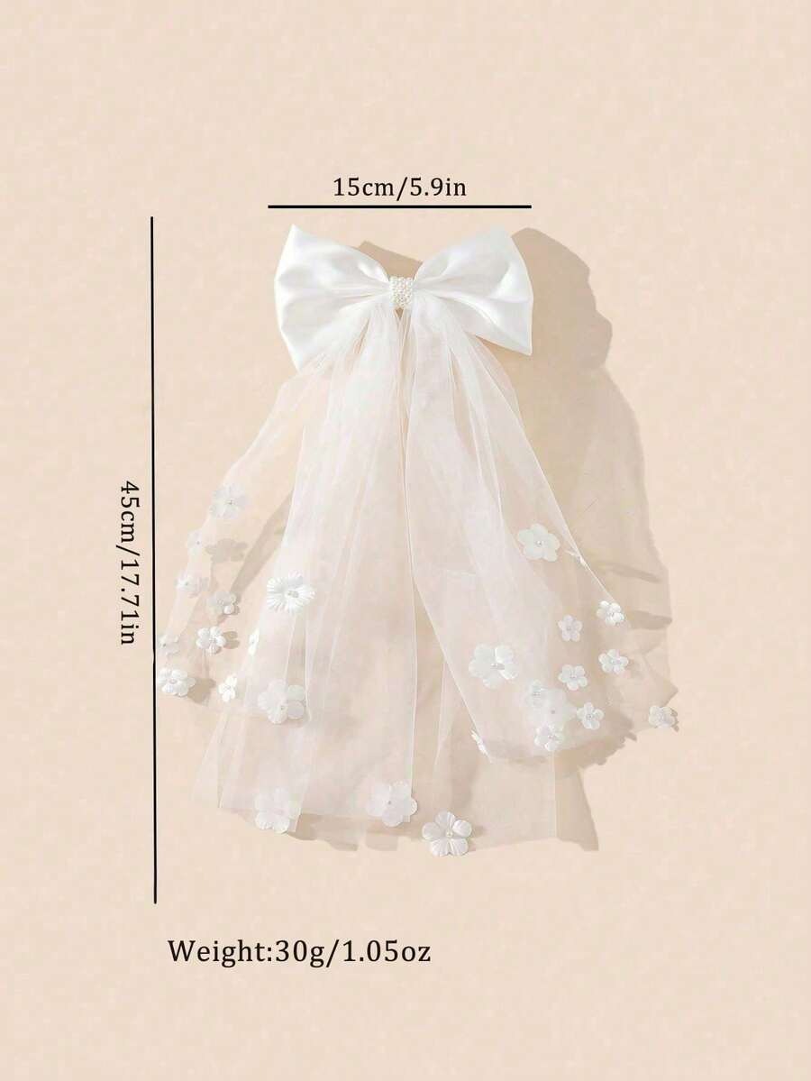 White satin bow communion veil with 3D floral appliqués showing dimensions 15cm wide x 45cm long
