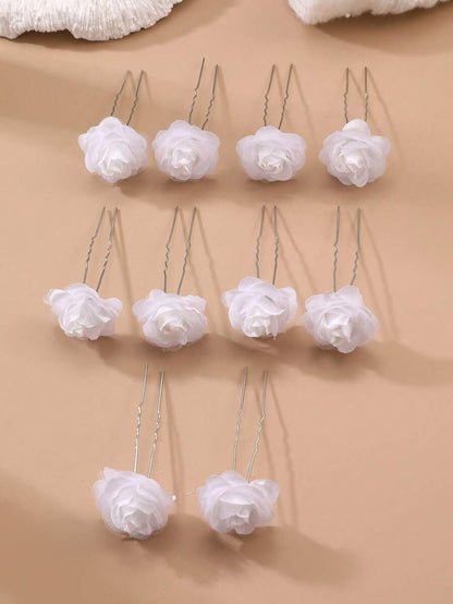 10 white chiffon rose hair pins arranged in rows on beige background, showing U-pin style