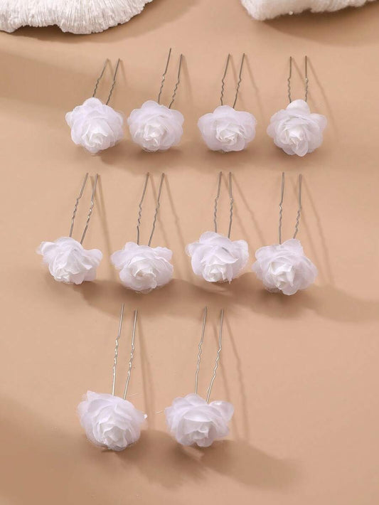 10 white chiffon rose hair pins arranged in rows on beige background, showing U-pin style