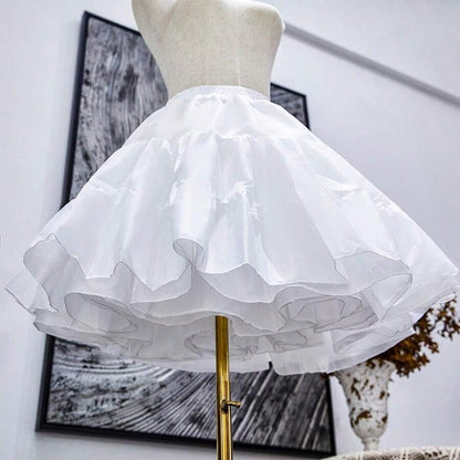 Close-up of girls white ruffle organza petticoat showing layered organza tiers