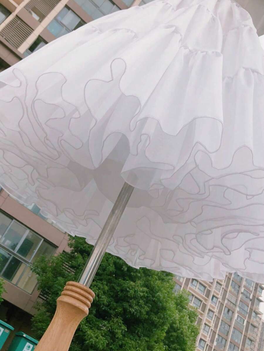 Close-up underside view of girls white 3-layer boneless petticoat showing tulle layers