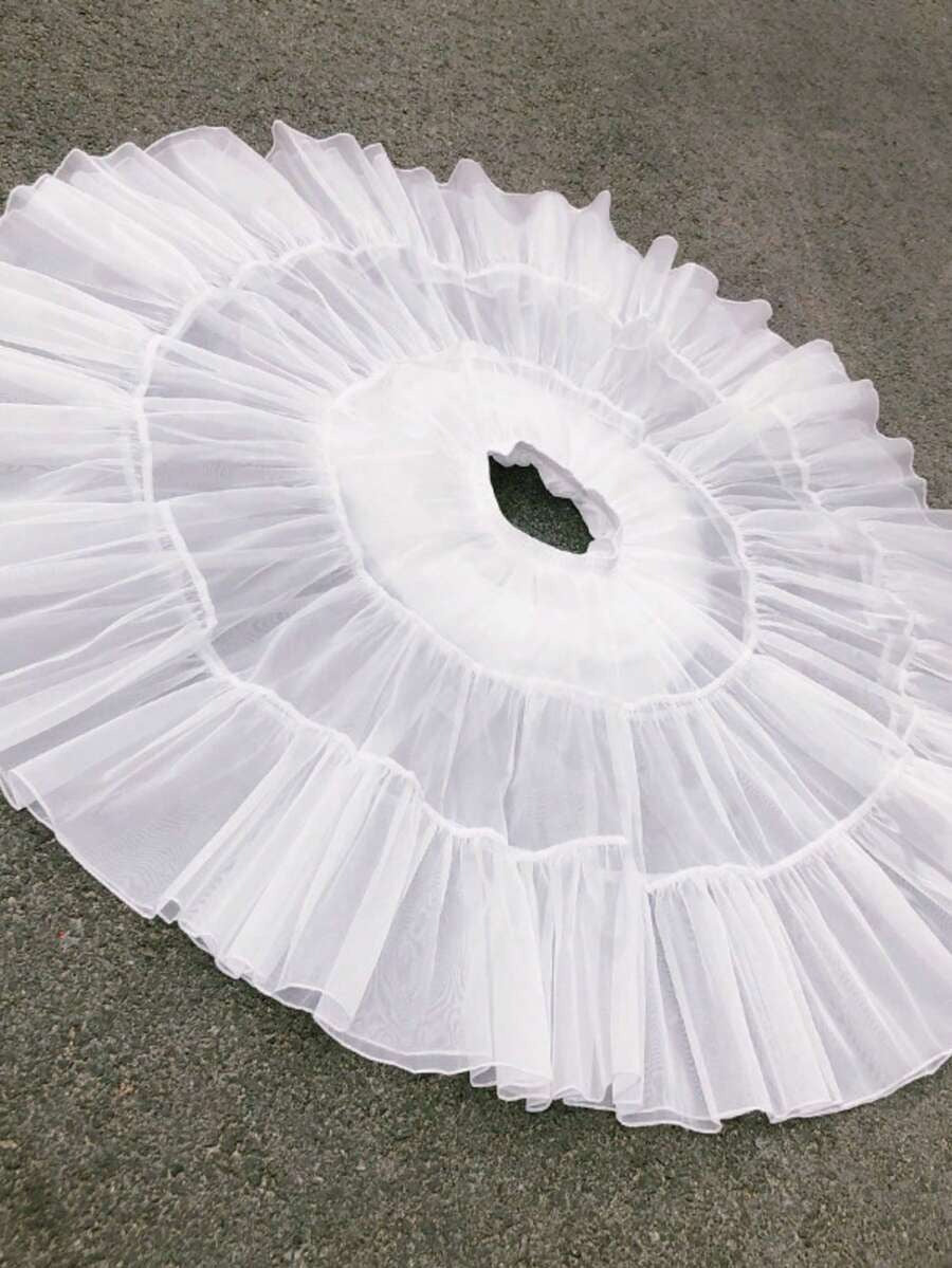 Girls white petticoat laid flat showing 3-layer tulle construction from above
