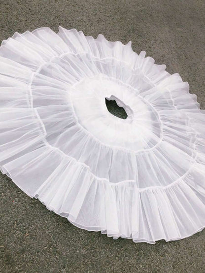 Girls white petticoat laid flat showing 3-layer tulle construction from above