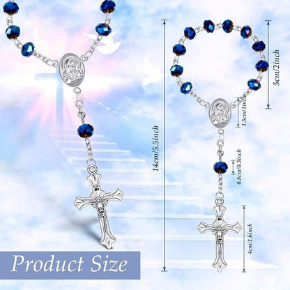 Blue crystal rosary bracelet held in hand showing mini rosary size with silver Madonna medal and INRI crucifix close-up detail