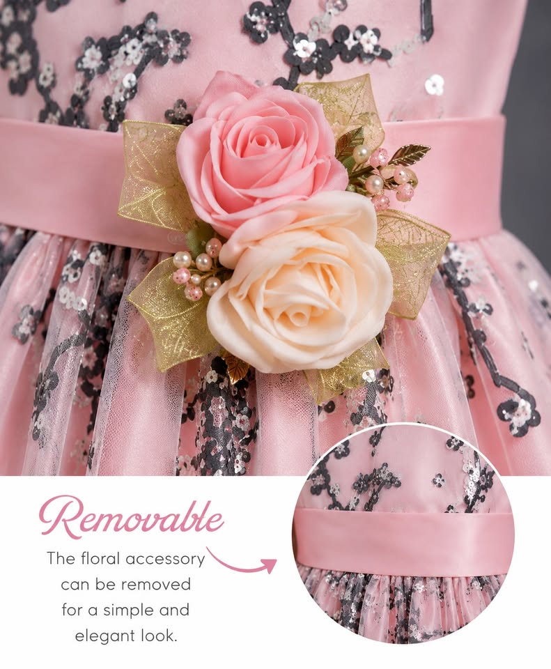 Pink floral accessory on a dress with text indicating it is removable.