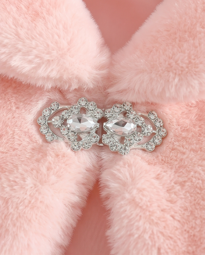 Pair of silver earrings with clear stones on a pink fur background