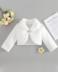 White children's jacket with a brooch on a gray background
