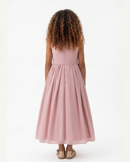 Girl wearing a pink dress on a white background