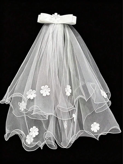 White wedding veil with floral embroidery on a black background