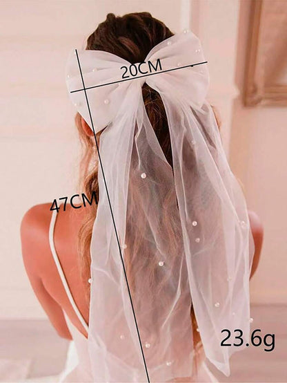 White veil with measurements and weight details on a plain background