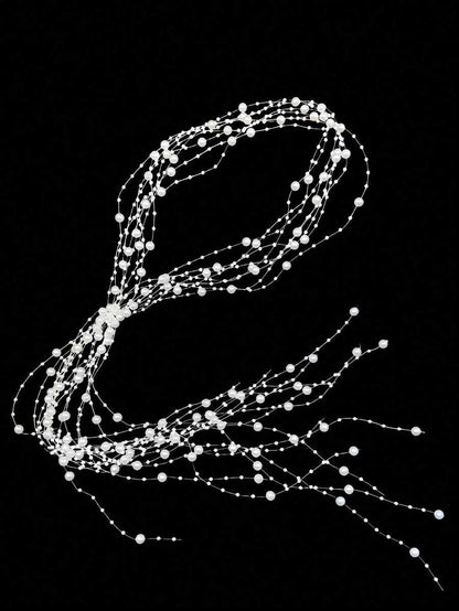 Decorative string of lights shaped like a '2' on a black background