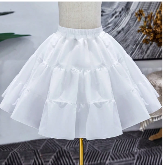 Girls white ruffle organza petticoat on mannequin, showing layered ruffle detail