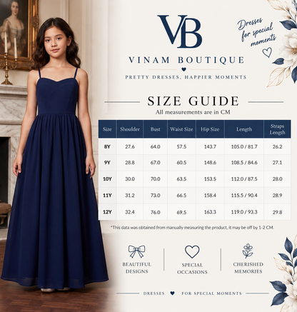 A size guide infographic for the Vinam Boutique, featuring a young girl modeling a navy blue maxi dress on the left, alongside a detailed size table from 8Y to 12Y with measurements in centimeters. The right side of the graphic features the brand logo 'VB' and decorative floral elements on a cream background.
