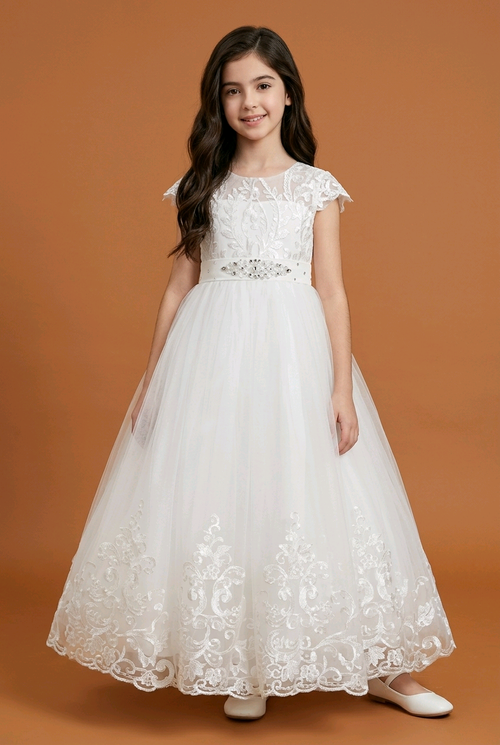 Young girl wearing a white lace dress on an orange background