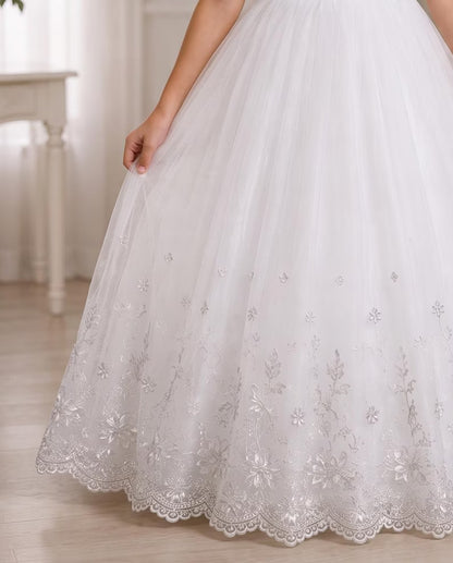 Child wearing a white communion dress
