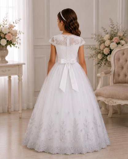 Child wearing a white communion dress