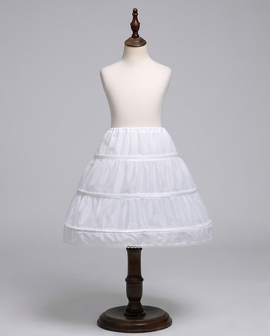 White petticoat on a mannequin against a gray background