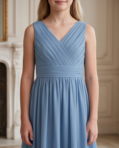 Girl wearing a dusty blue bridesmaid dress 