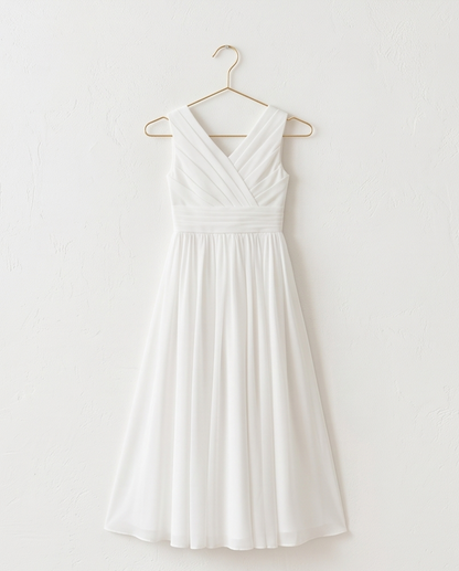 White dress on a hanger against a white background