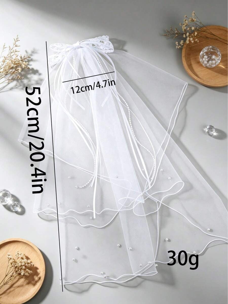 White veil with measurements and weight on a light gray background