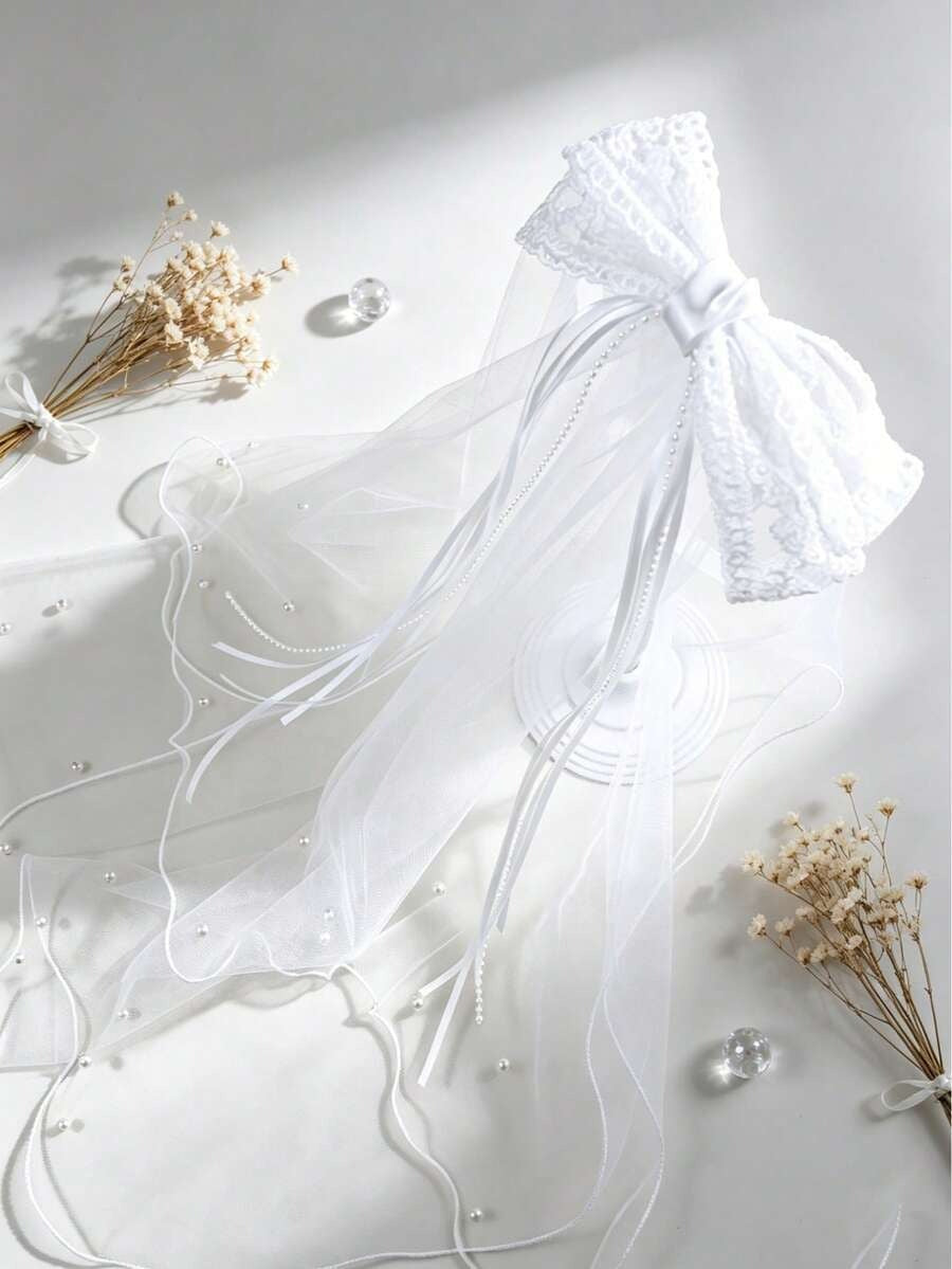 white veil with bow in the middle